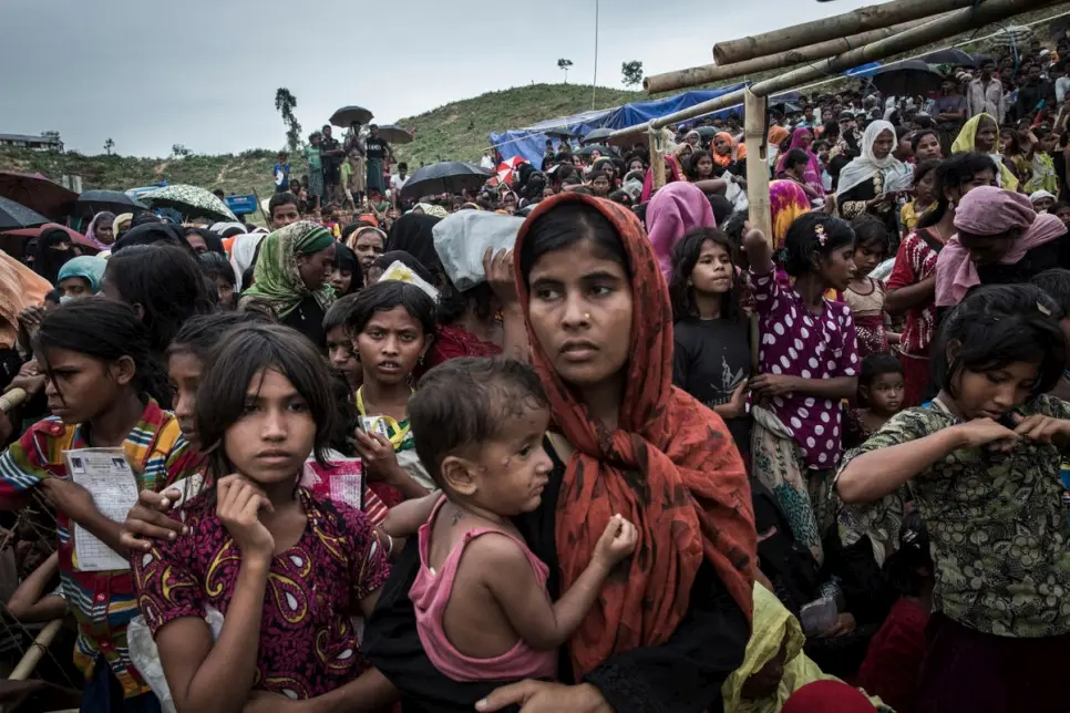 A crowd of South-East Asian women and children, mostly wearing Muslim attire