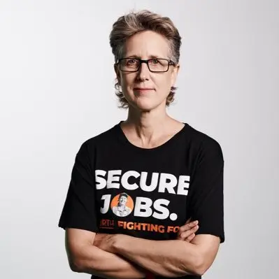 Sally McManus wearing a shirt reading “secure jobs”